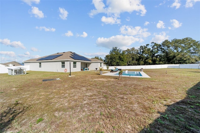 view of yard with a fenced in pool