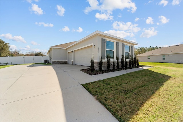 view of side of property featuring a yard and a garage