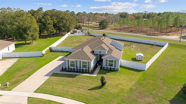 birds eye view of property with a rural view