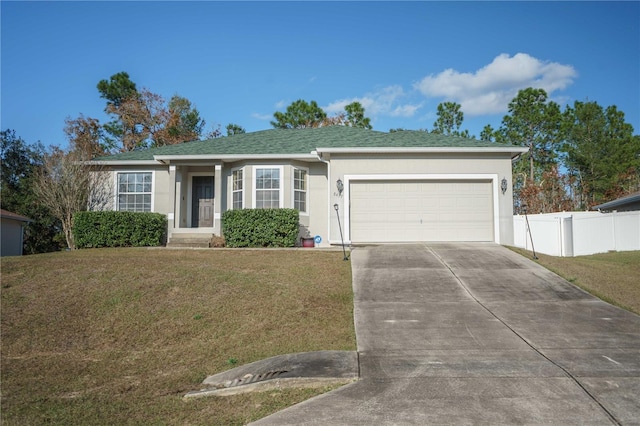 single story home featuring a garage and a front yard