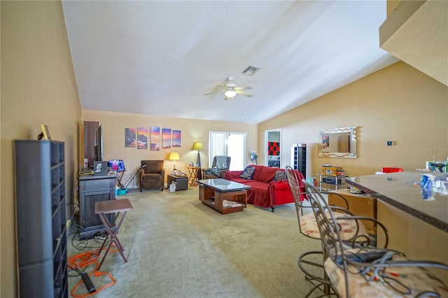 carpeted living room featuring ceiling fan and lofted ceiling