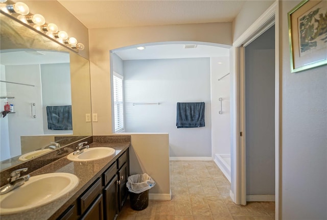 bathroom featuring vanity and walk in shower