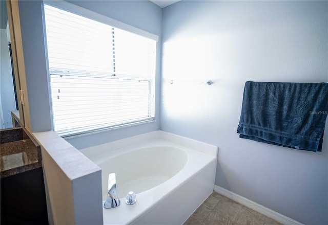 bathroom with a bathtub and vanity