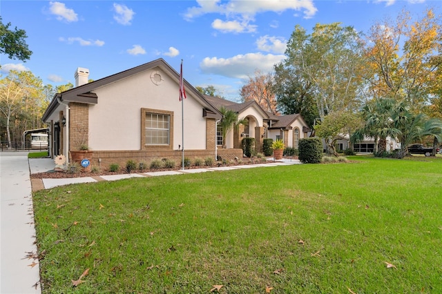 view of front of house featuring a front lawn and a carport