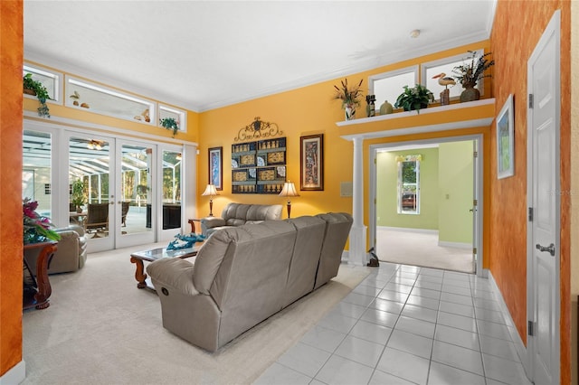 living room featuring light tile patterned floors, french doors, and crown molding