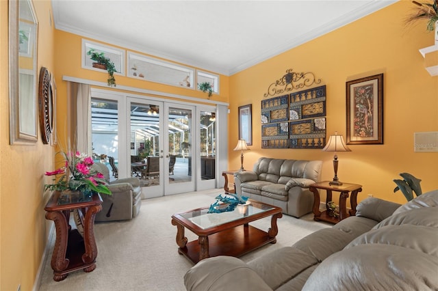 carpeted living room featuring crown molding and french doors