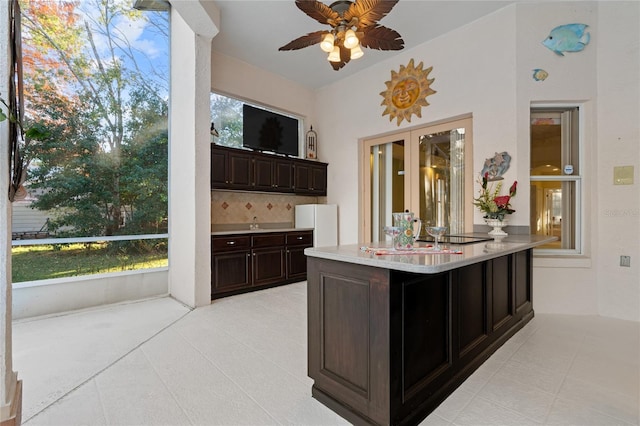 interior space featuring plenty of natural light and ceiling fan