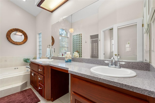 bathroom with tile patterned floors, vanity, and separate shower and tub