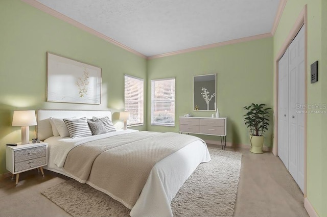 bedroom with crown molding and a closet