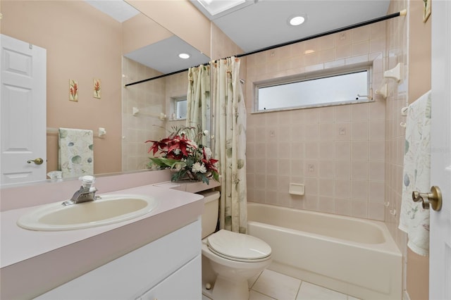 full bathroom featuring shower / bath combo with shower curtain, tile patterned flooring, vanity, and toilet