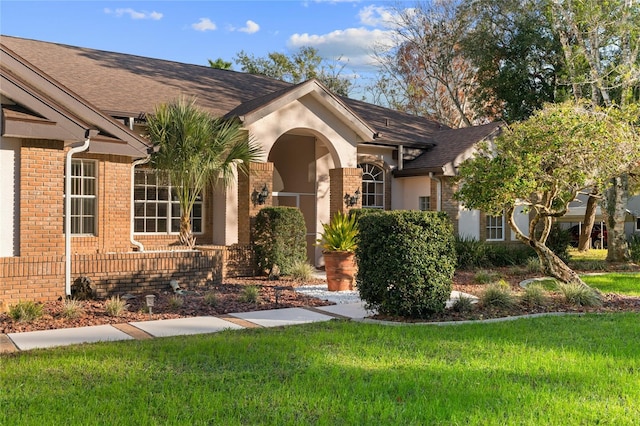 ranch-style house with a front yard