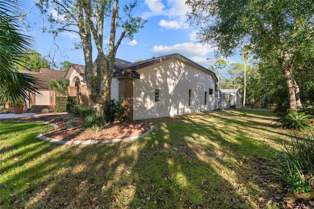 view of home's exterior with a yard