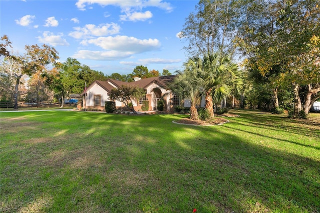 view of front of property with a front lawn