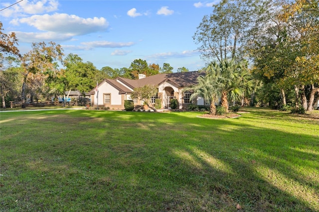 single story home with a front yard