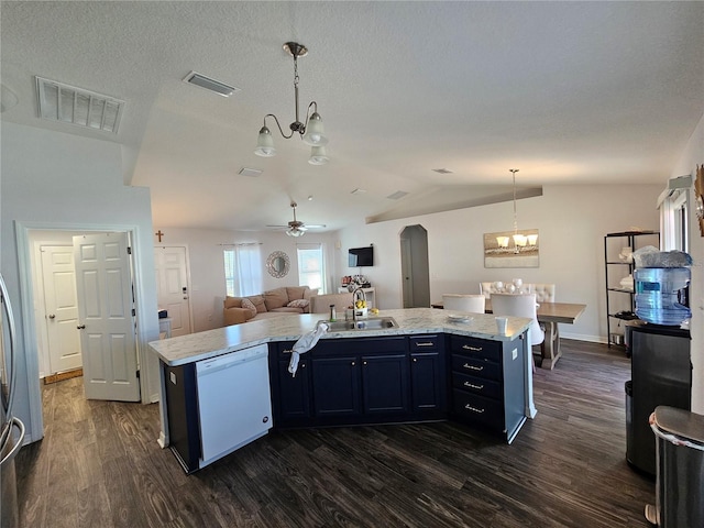 kitchen with dishwasher, an island with sink, hanging light fixtures, and ceiling fan with notable chandelier