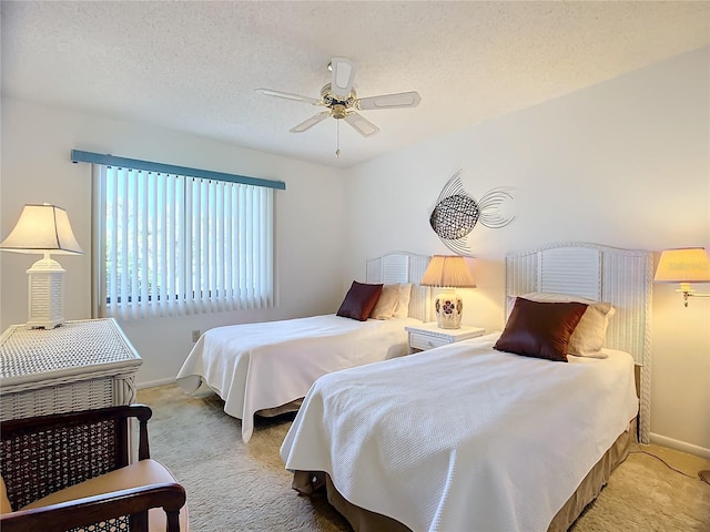 bedroom with light carpet, a textured ceiling, and ceiling fan