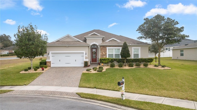 ranch-style house with a garage and a front lawn