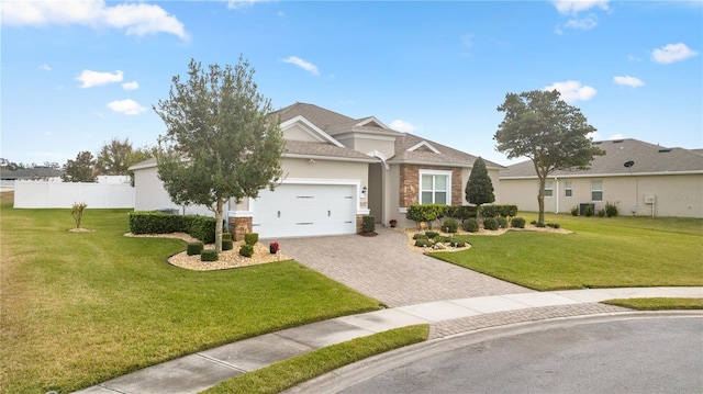 view of front of house with a garage and a front lawn