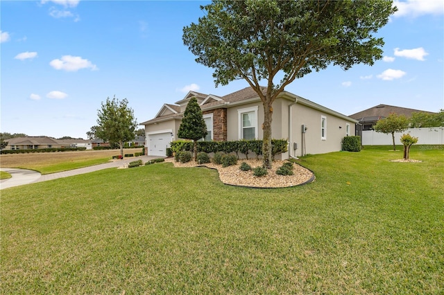 single story home with a garage and a front lawn