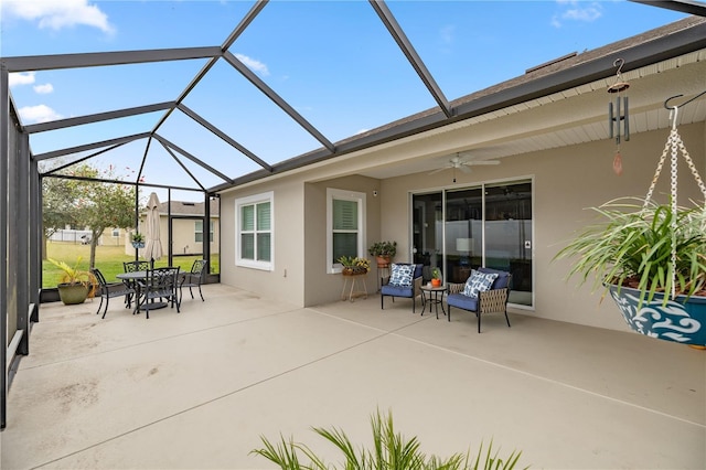 view of patio / terrace with glass enclosure and ceiling fan