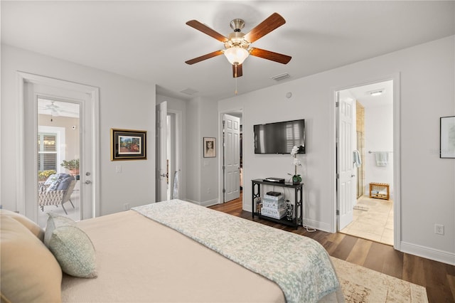 bedroom with access to exterior, ensuite bathroom, ceiling fan, and dark hardwood / wood-style floors