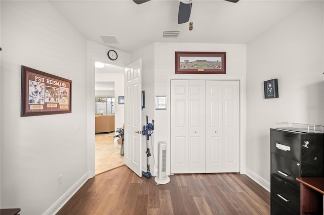 interior space with ceiling fan and hardwood / wood-style floors