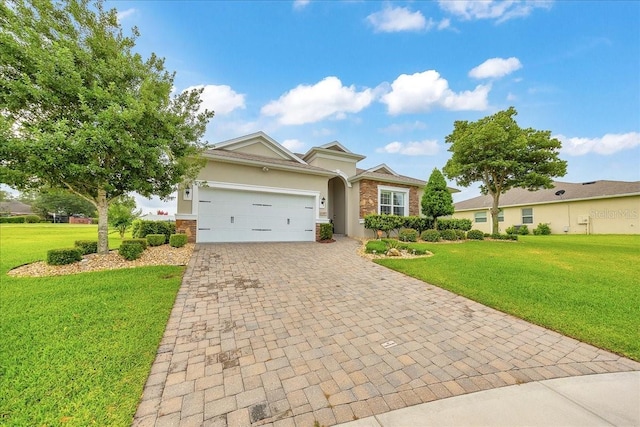 6407 SW 45th Ave, Ocala, FL 34474 - single story home with decorative driveway, an attached garage, stucco siding, a front lawn, and stone siding