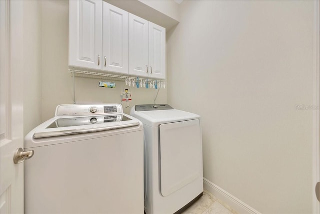 6407 SW 45th Ave, Ocala, FL 34474 - washroom featuring cabinet space, washer and dryer, and baseboards