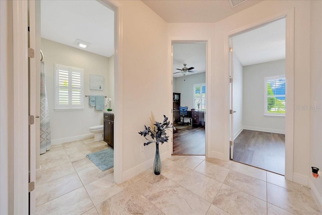 6407 SW 45th Ave, Ocala, FL 34474 - hall featuring an office area, baseboards, and tile patterned floors