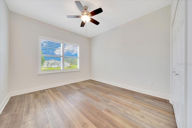 6407 SW 45th Ave, Ocala, FL 34474 - unfurnished room featuring light wood-style floors, a ceiling fan, and baseboards