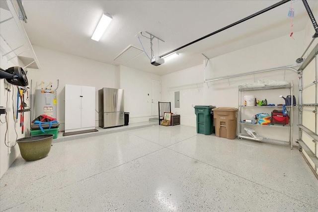 6407 SW 45th Ave, Ocala, FL 34474 - garage with freestanding refrigerator, water heater, a garage door opener, and electric panel