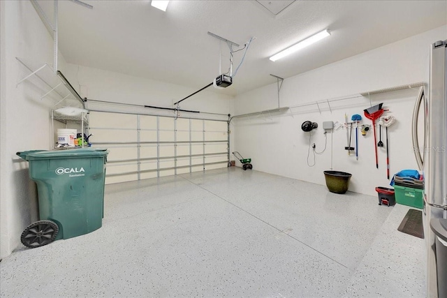 6407 SW 45th Ave, Ocala, FL 34474 - garage with a garage door opener and freestanding refrigerator