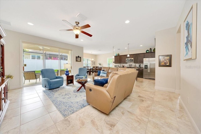 6407 SW 45th Ave, Ocala, FL 34474 - living area with a ceiling fan, baseboards, and recessed lighting
