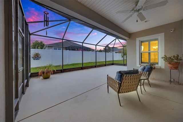 6407 SW 45th Ave, Ocala, FL 34474 - patio terrace at dusk with a ceiling fan, a patio area, and a lanai