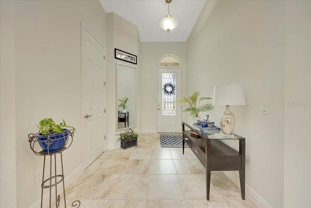 6407 SW 45th Ave, Ocala, FL 34474 - foyer with baseboards and vaulted ceiling