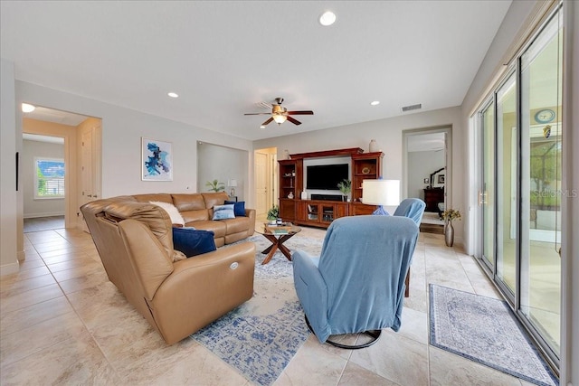 6407 SW 45th Ave, Ocala, FL 34474 - living room with light tile patterned floors, ceiling fan, recessed lighting, and baseboards