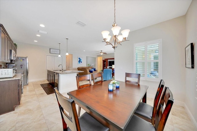 6407 SW 45th Ave, Ocala, FL 34474 - dining room featuring a chandelier, recessed lighting, ceiling fan, light tile patterned flooring, and baseboards