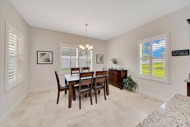6407 SW 45th Ave, Ocala, FL 34474 - dining room with a chandelier, plenty of natural light, and baseboards