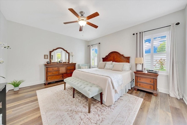 6407 SW 45th Ave, Ocala, FL 34474 - bedroom featuring light wood-type flooring, baseboards, and ceiling fan