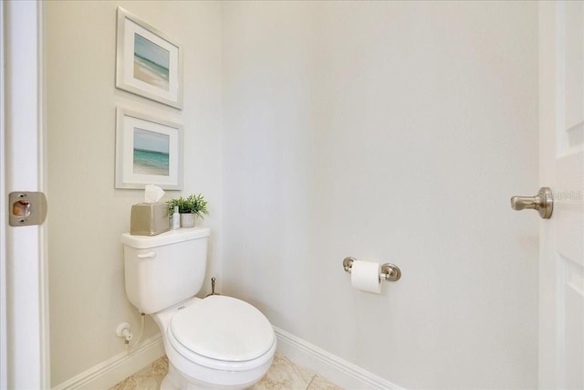 6407 SW 45th Ave, Ocala, FL 34474 - bathroom featuring toilet and baseboards