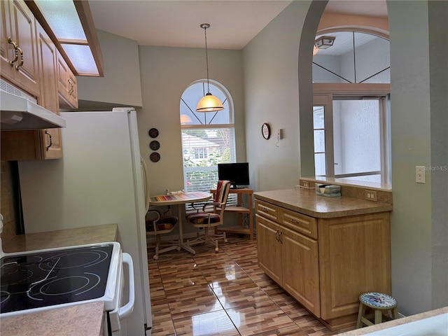 kitchen featuring stove and decorative light fixtures