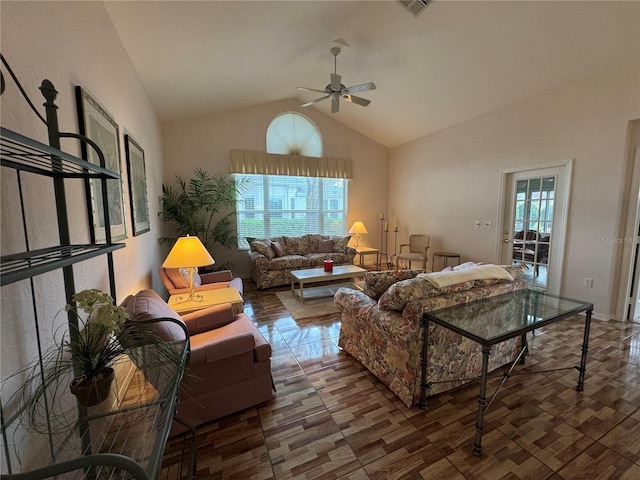 living room with ceiling fan and high vaulted ceiling