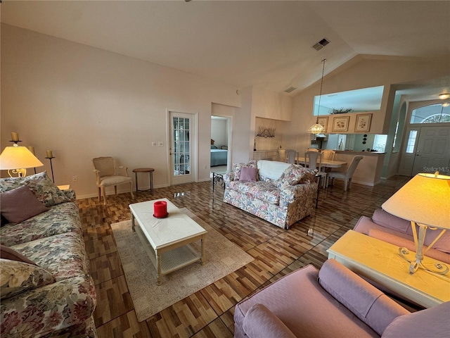 living room with dark hardwood / wood-style floors and lofted ceiling