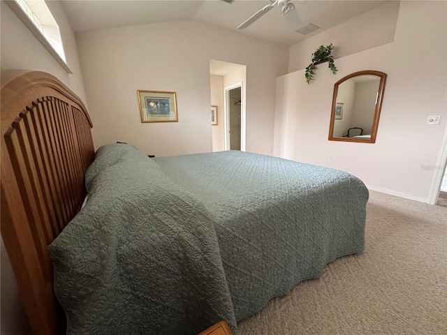 carpeted bedroom featuring ceiling fan and lofted ceiling