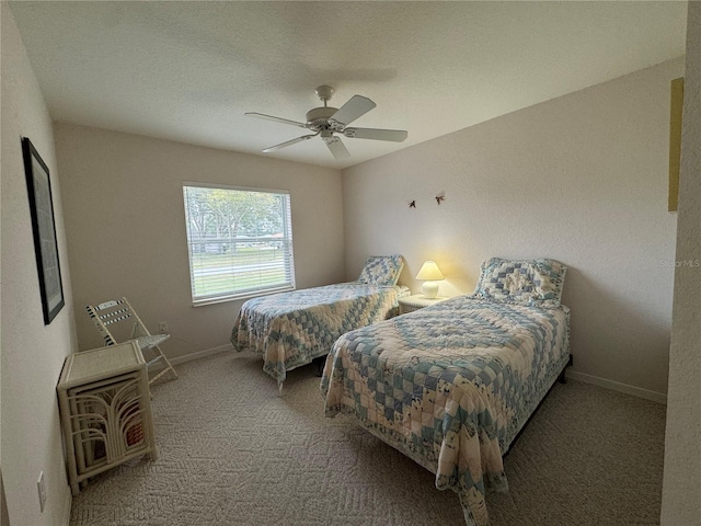 bedroom with ceiling fan and carpet floors