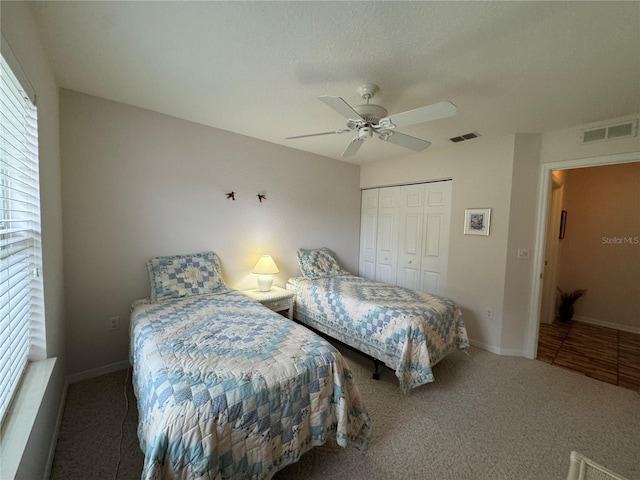 bedroom with carpet, a closet, and ceiling fan