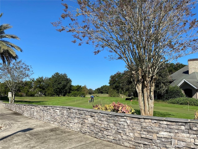 surrounding community featuring a yard