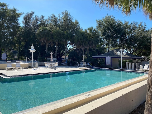 view of swimming pool featuring a patio area