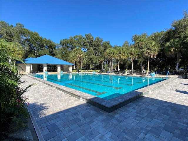 view of swimming pool featuring a patio area