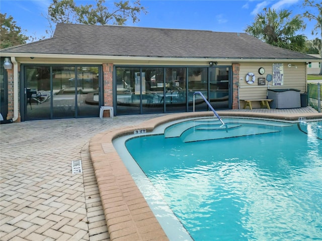 view of swimming pool with a patio area